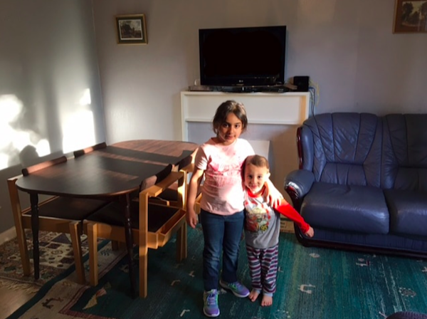 Elmbridge Can Refugee Support Fund children in refurbished lounge sitting room