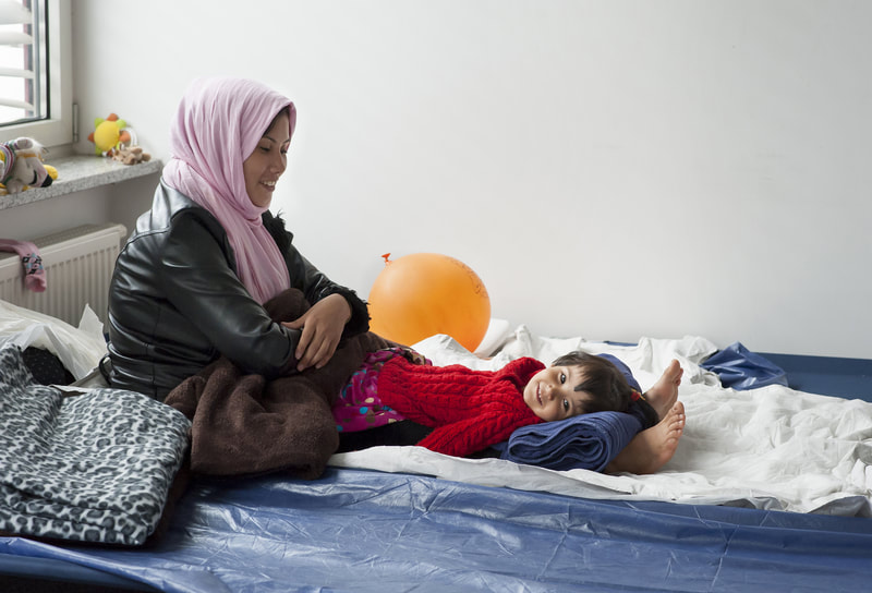 Displaced woman with child in temporary accommodation ©shutterstock Jazzmany
